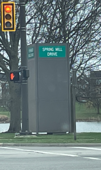 Street signs at the intersection of Spring Mill Dr and Fishinger Blvd in Columbus, Ohio