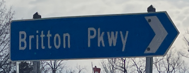 Roundabout street sign for Britton Pkwy in Hilliard, Ohio