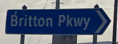 Roundabout street sign for Britton Pkwy in Hilliard, Ohio