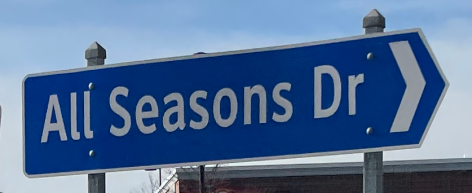 Roundabout street sign for All Seasons Dr in Hilliard, Ohio
